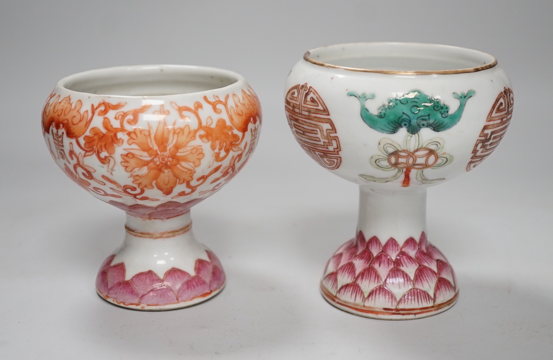 Two 19th century Chinese enamelled porcelain stem bowls, each painted with bats and Shou, the foot with Lotus petals, tallest 11cm